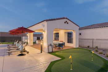 Poolside putting green areaStainless Steel Appliances and vinyl wood plank flooring at Pillar at Fountain Hills apartments